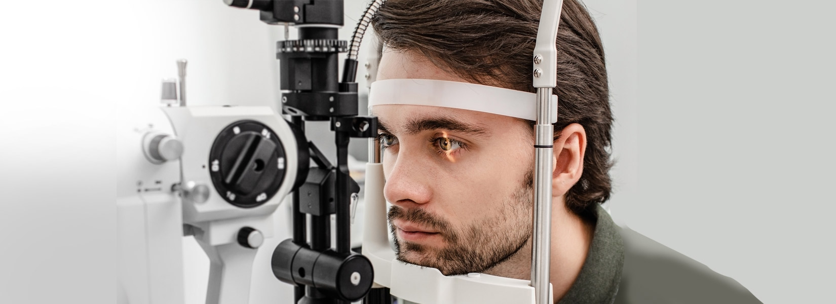 young man during eye exam in Lake Ozark